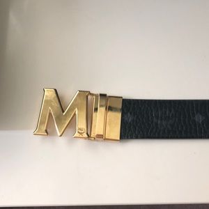 gold and black mcm belt